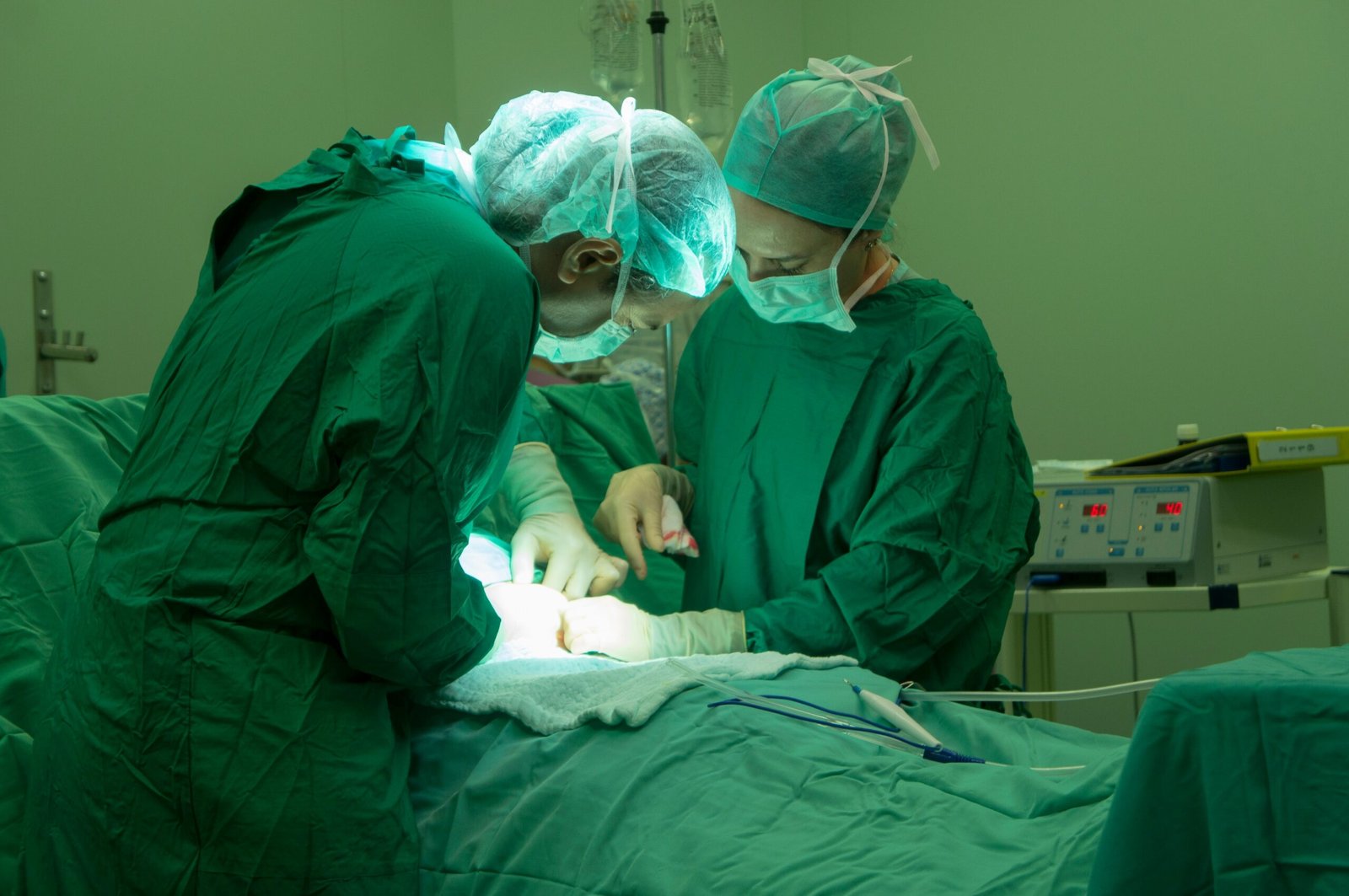 a group of doctors performing surgery on a patient